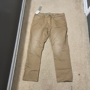 Brand new men’s athletic fit jeans in khaki